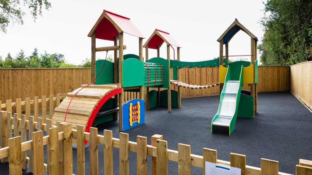 The garden — tent, huts, outdoor bar, and play area